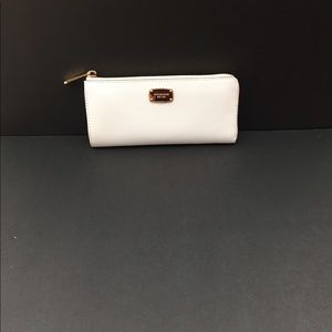 Michael Kors white wallet.